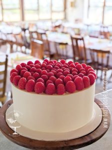 Luxury raspberry dessert slab wedding cake topped with fresh raspberries, created by Tasty Bakes & Wedding Cakes in Adelaide.